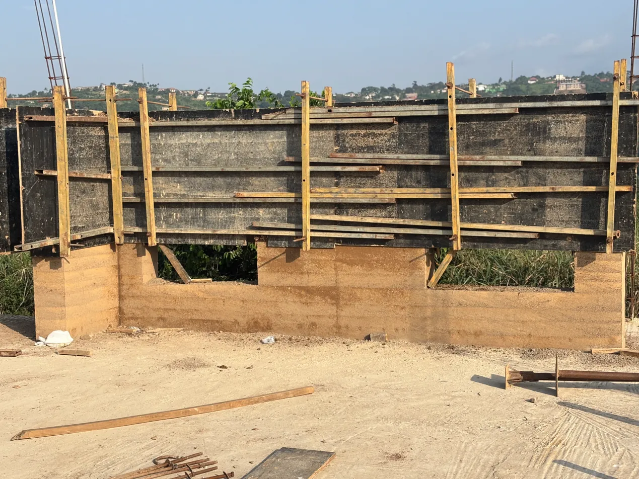 Precision formwork in place for rammed earth wall