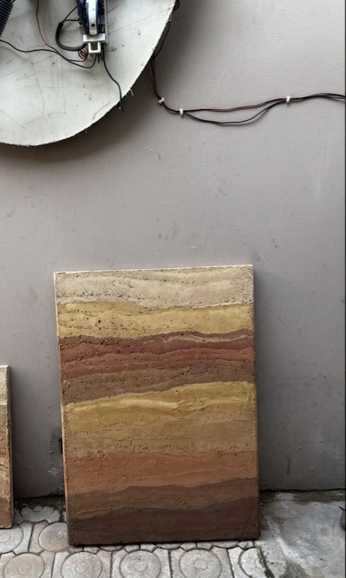 Layered earth plaster sample board for client selection